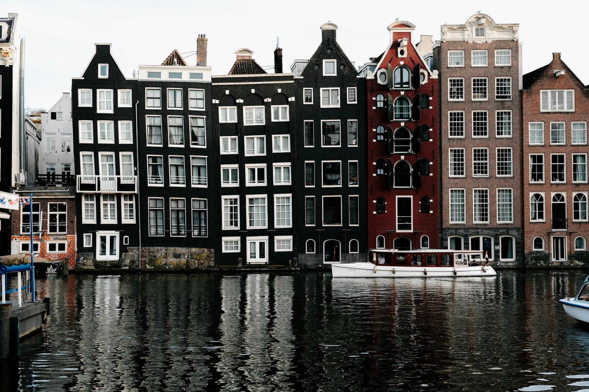 Amsterdam Netherlands canal houses bicycles reflections