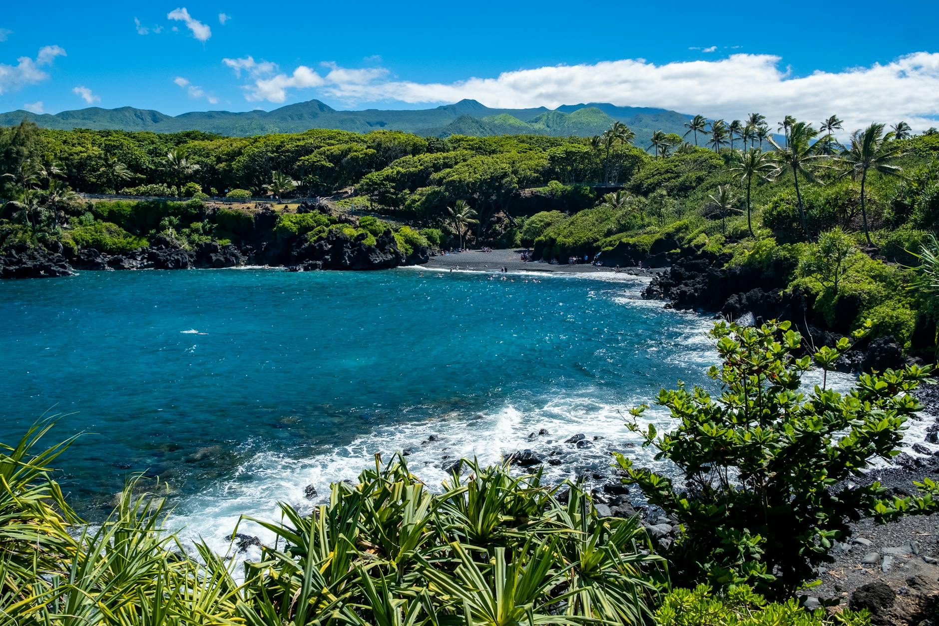 Wainapanapa black sand beach Maui Hawaii tropical jungle cove