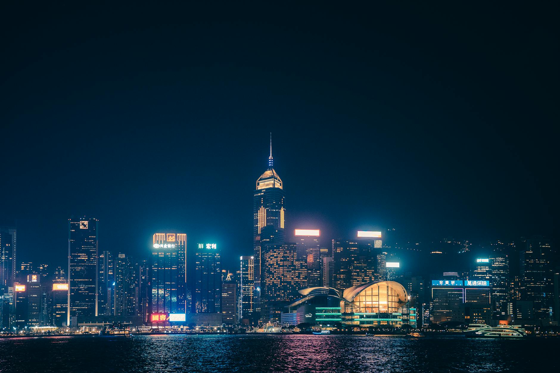 Hong Kong Victoria Harbour night skyline neon lights Kowloon waterfront
