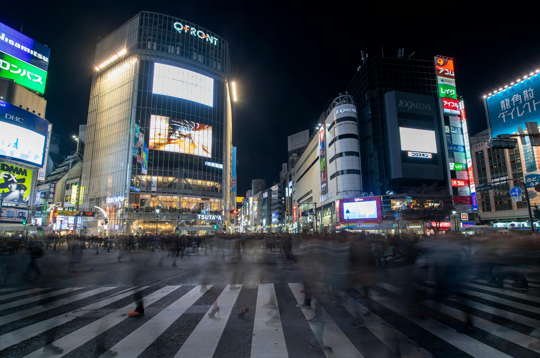 Tokyo Japan Shibuya crossing neon lights night crowds long exposure