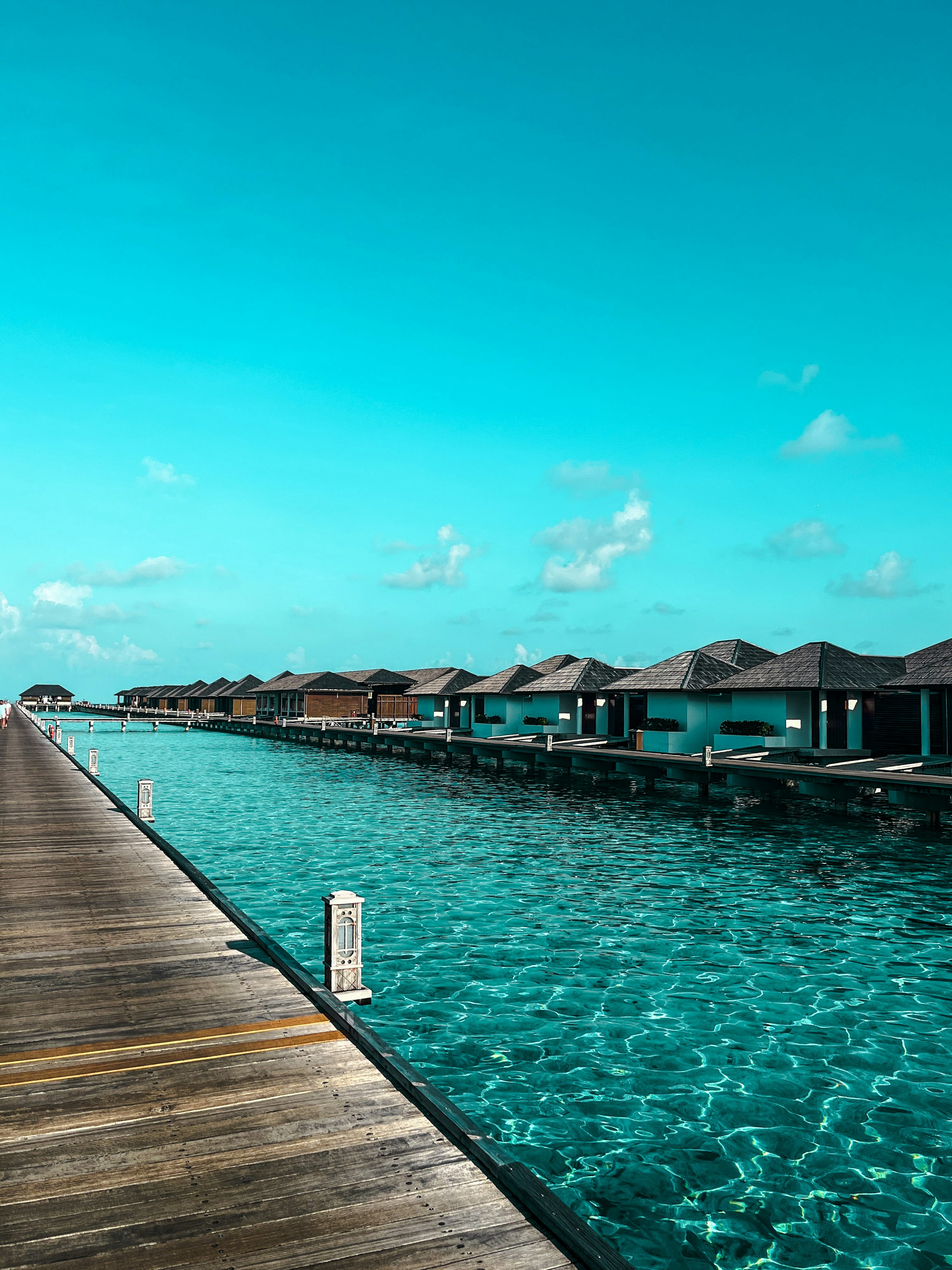 Maldives overwater villas crystal clear turquoise Indian Ocean