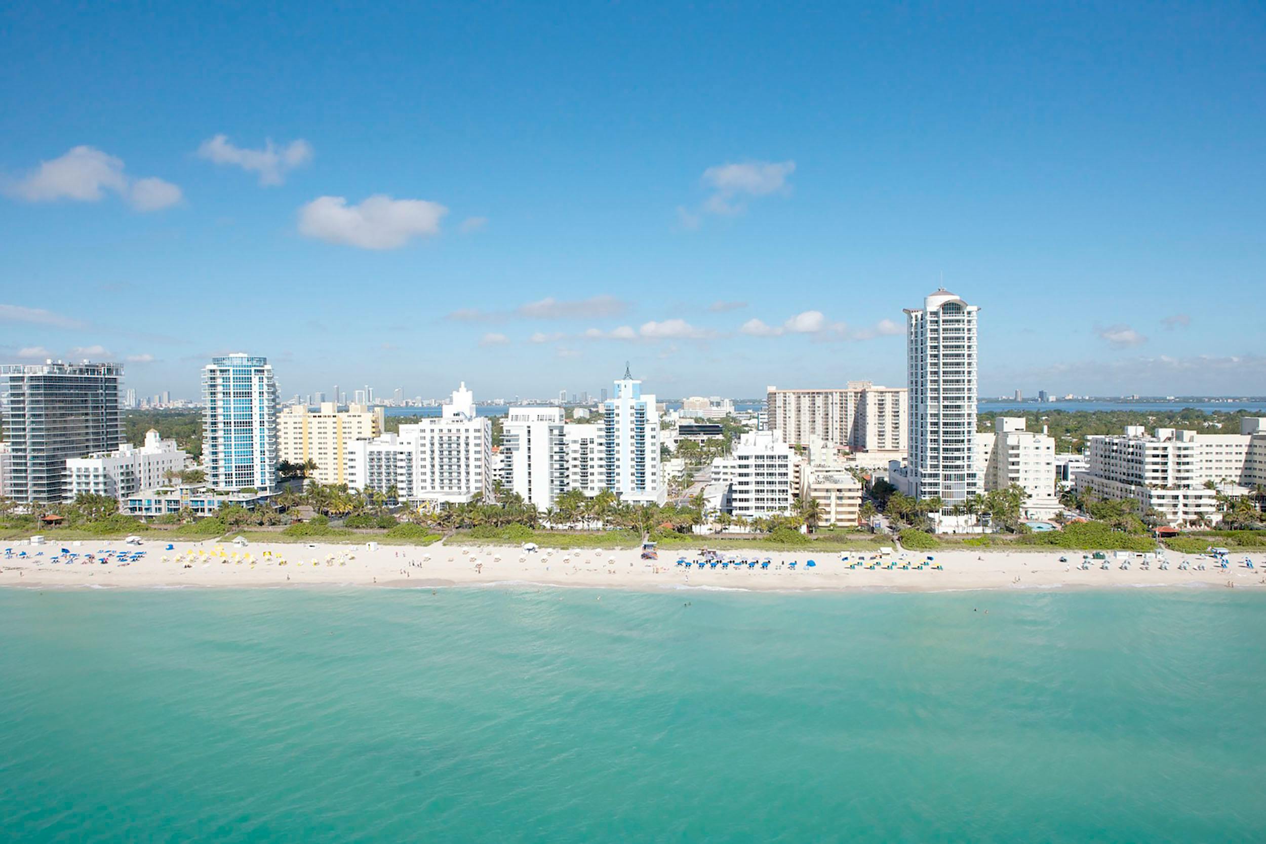 South Beach Miami Florida aerial turquoise water white sand beach skyline