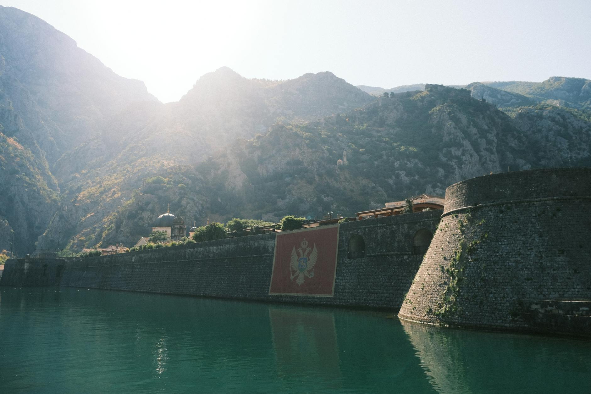 Kotor Montenegro medieval city walls Montenegrin flag fortifications