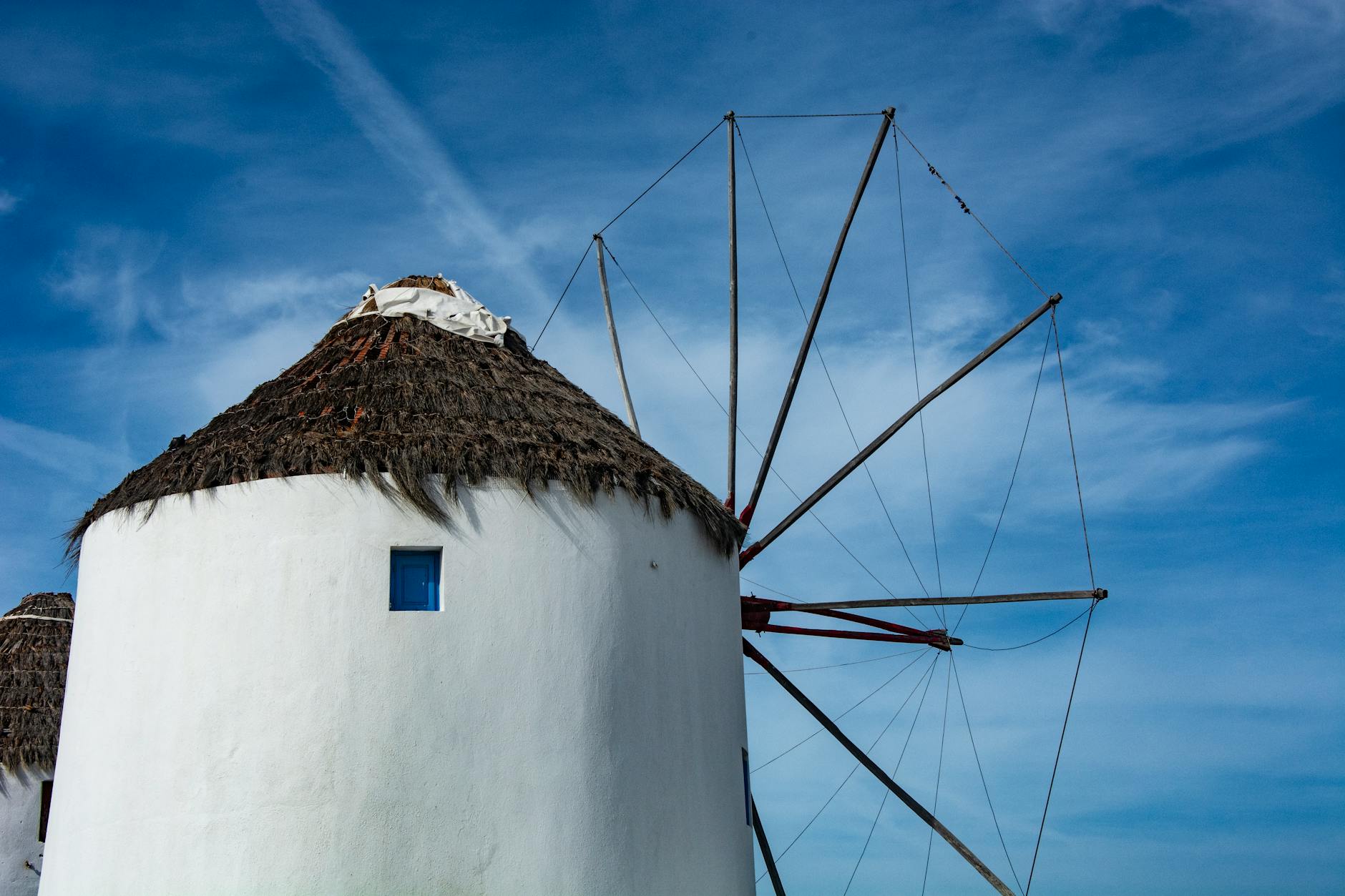 Mykonos windmill close-up thatched roof blue sky Greece