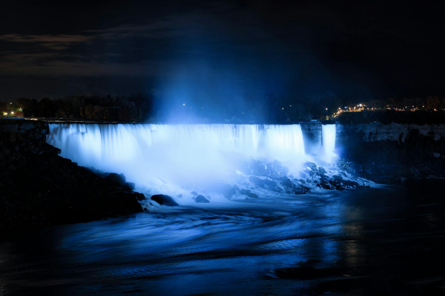 Niagara Falls Canada Horseshoe Falls illuminated blue lights night long exposure