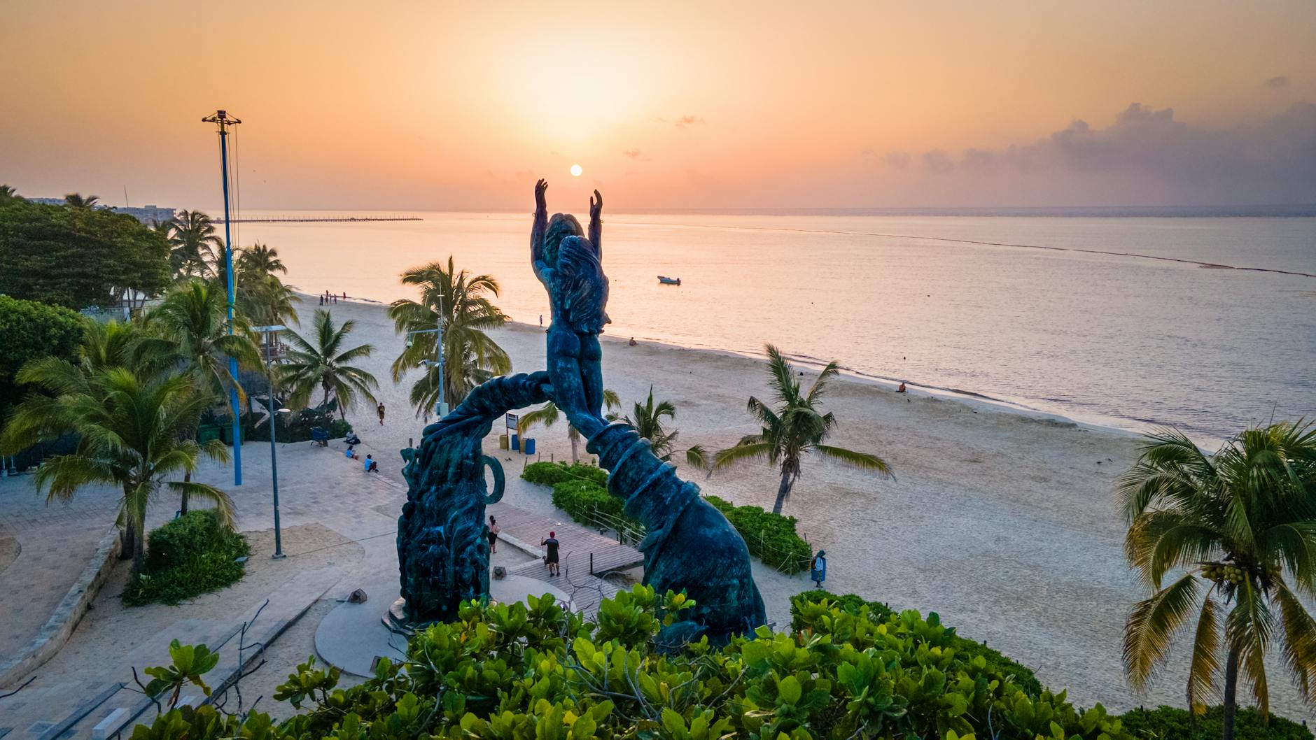 Portal Maya statue Playa del Carmen Mexico beach at sunset