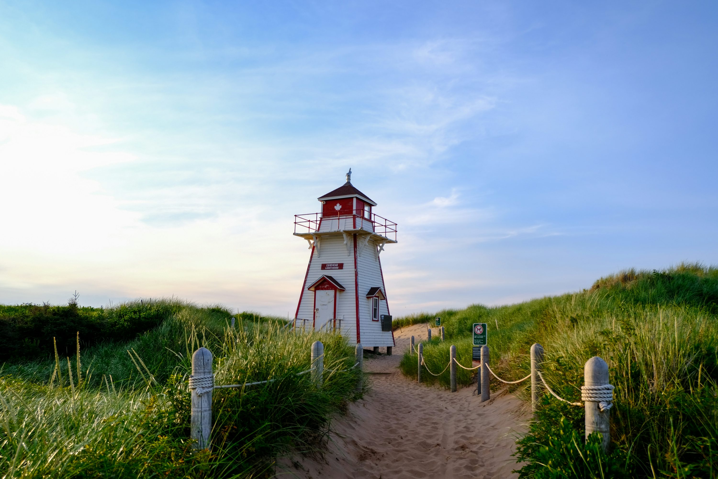 Prince Edward Island lighthouse on red sandstone cliffs PEI Canada