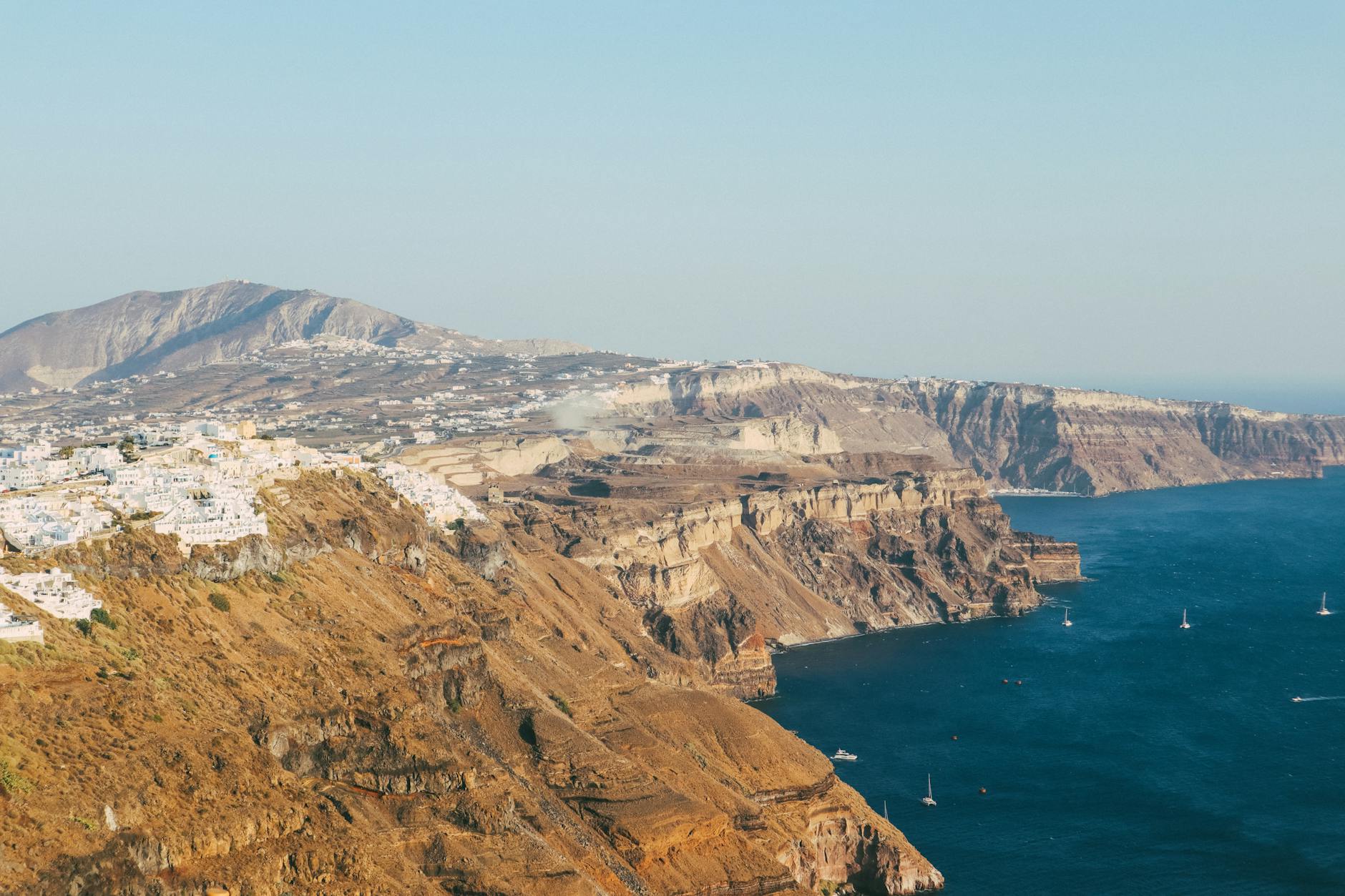 Santorini caldera cliffs aerial view volcanic landscape Aegean Sea
