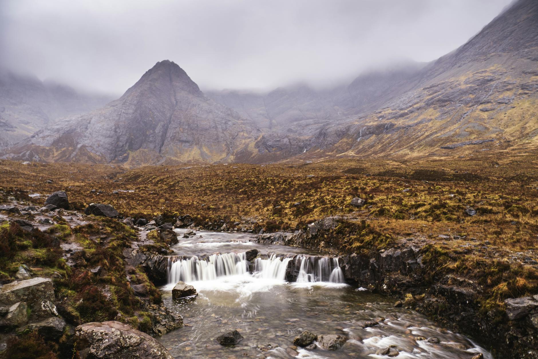 Isle of Skye Fairy Pools Black Cuillin mountains waterfall misty Scotland