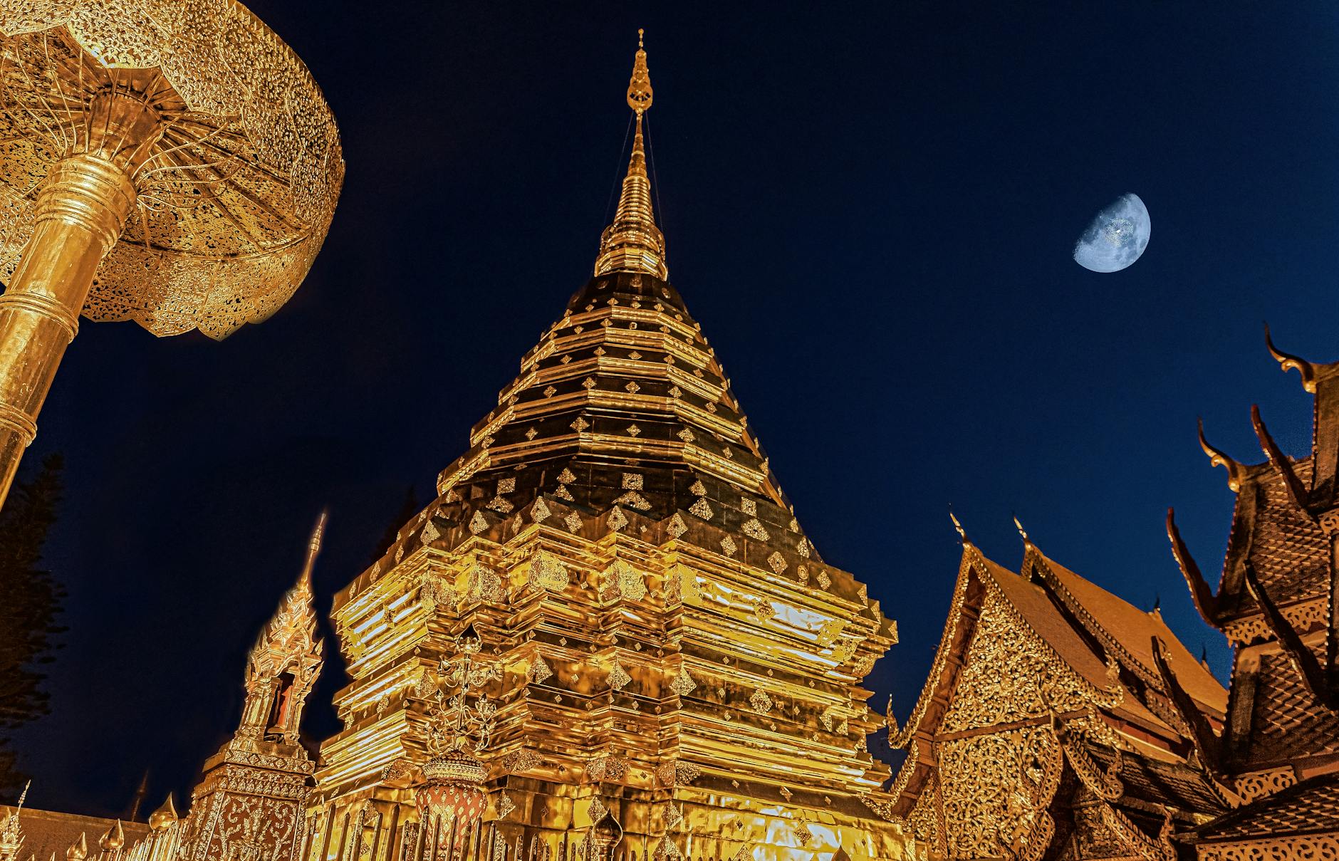 Doi Suthep temple Chiang Mai Thailand golden chedi illuminated night moon