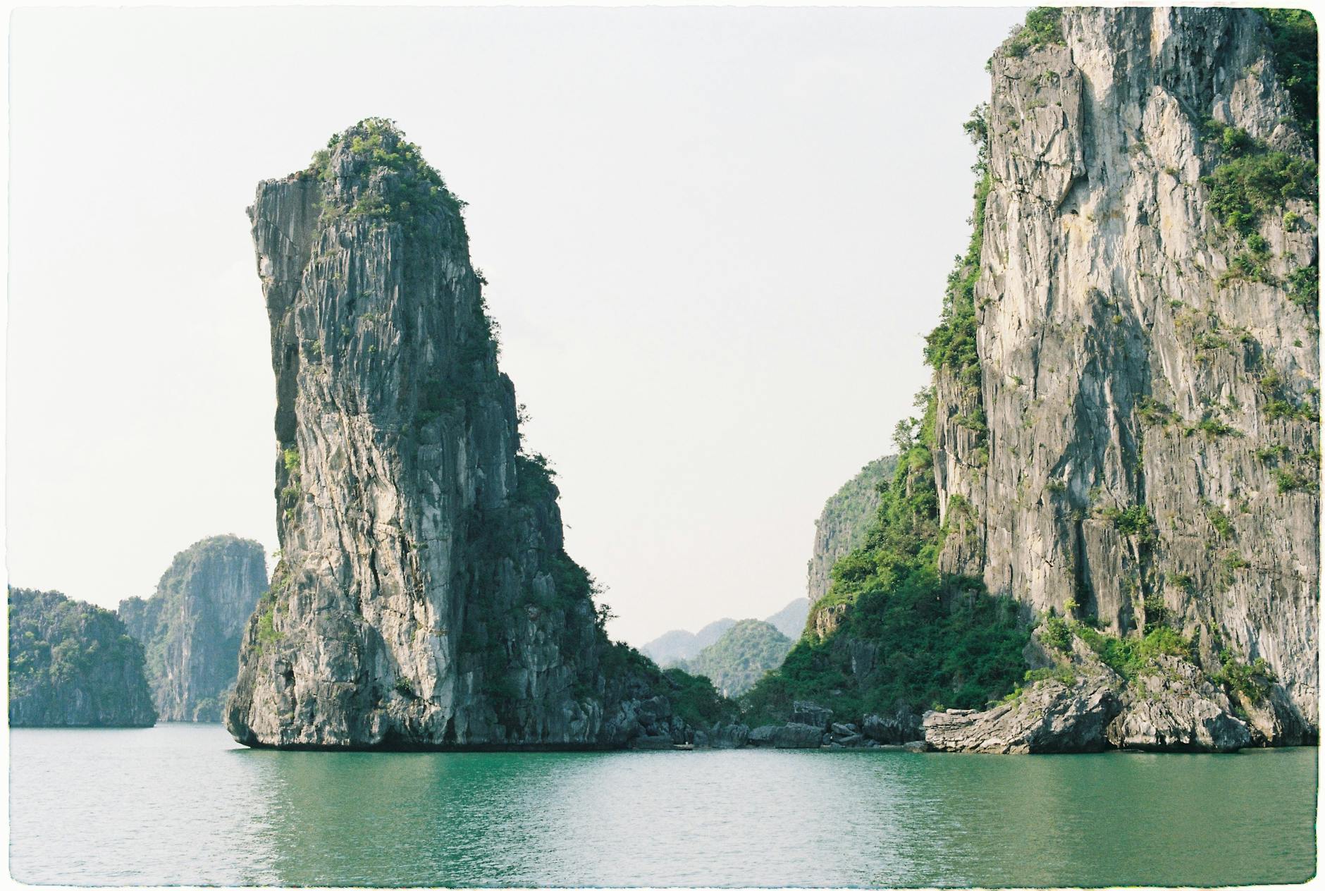 Ha Long Bay Vietnam limestone karst pillars emerald water cruise
